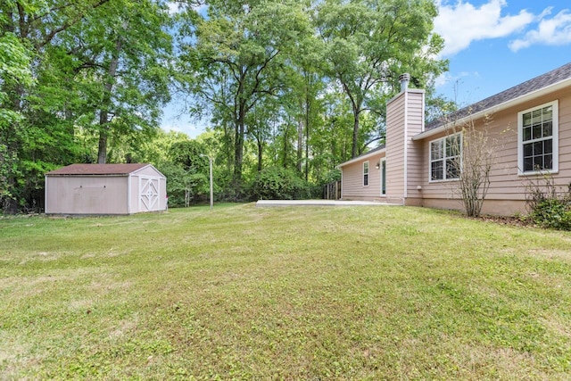 2304 Chester Ct, Tallahassee, FL 32312 - view of yard featuring a storage unit and an outbuilding