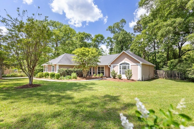 2304 Chester Ct, Tallahassee, FL 32312 - ranch-style home with stucco siding, a front lawn, and fence