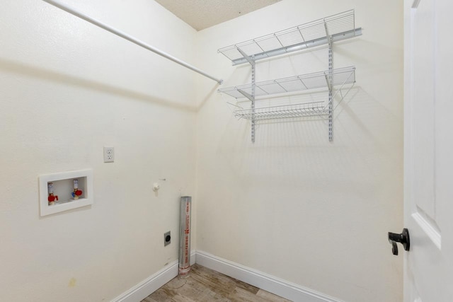 2304 Chester Ct, Tallahassee, FL 32312 - washroom featuring hookup for a washing machine, hookup for an electric dryer, light wood-style floors, baseboards, and laundry area
