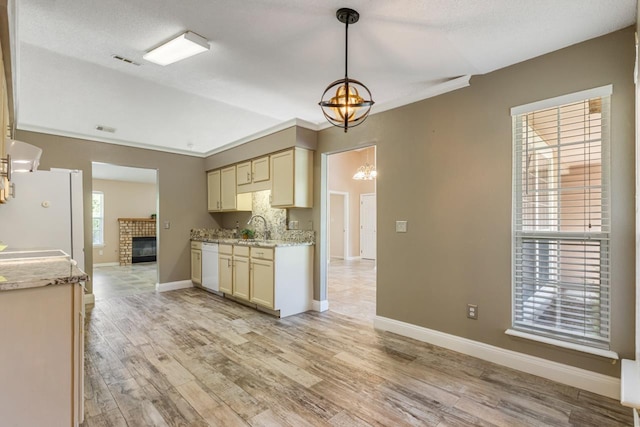 2304 Chester Ct, Tallahassee, FL 32312 - kitchen with light wood-style floors, an inviting chandelier, visible vents, and white appliances