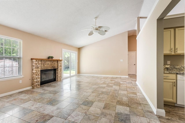 2304 Chester Ct, Tallahassee, FL 32312 - unfurnished living room with lofted ceiling, plenty of natural light, a ceiling fan, and a brick fireplace