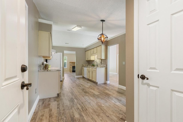 2304 Chester Ct, Tallahassee, FL 32312 - kitchen with light wood-type flooring, baseboards, and white appliances
