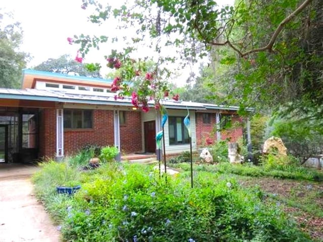 view of front of property with a carport