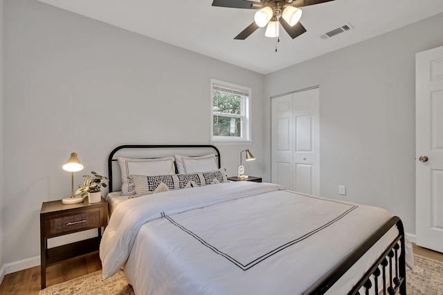 bedroom featuring a closet, ceiling fan, and light hardwood / wood-style flooring