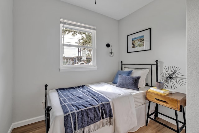 bedroom with hardwood / wood-style flooring