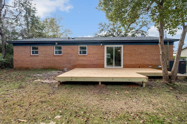 back of house featuring a wooden deck and central AC