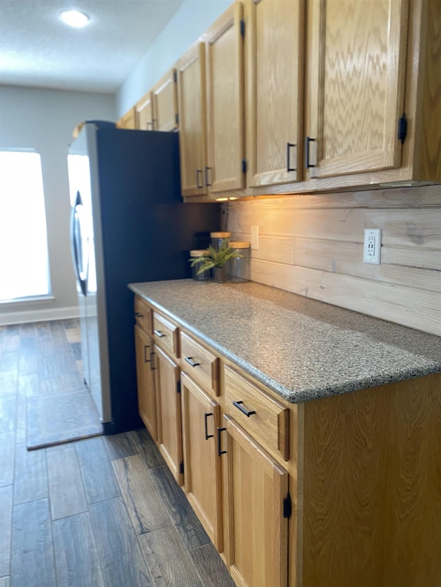 kitchen with decorative backsplash, dark wood-type flooring, and light brown cabinets