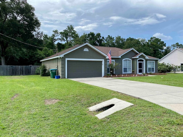 single story home featuring a garage and a front yard