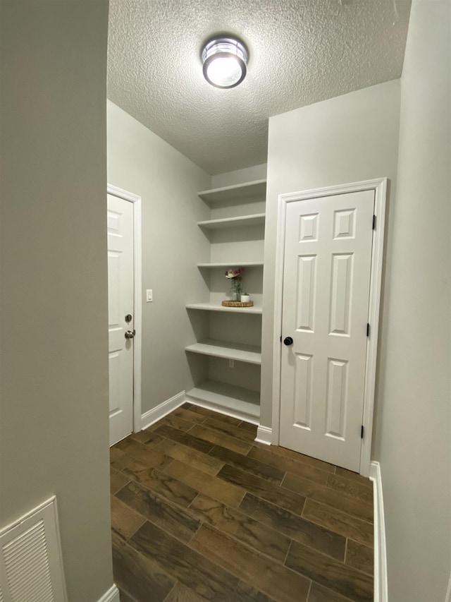 interior space with a textured ceiling