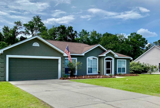 ranch-style house featuring a garage and a front yard