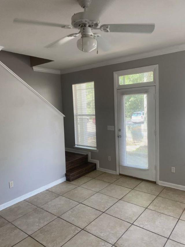 1417 Pullen Rd Unit 101, Tallahassee, FL 32303 - entrance foyer with ornamental molding, light tile patterned floors, and a ceiling fan