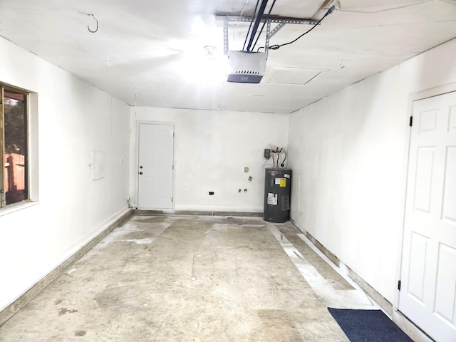 garage with baseboards, electric water heater, and a garage door opener