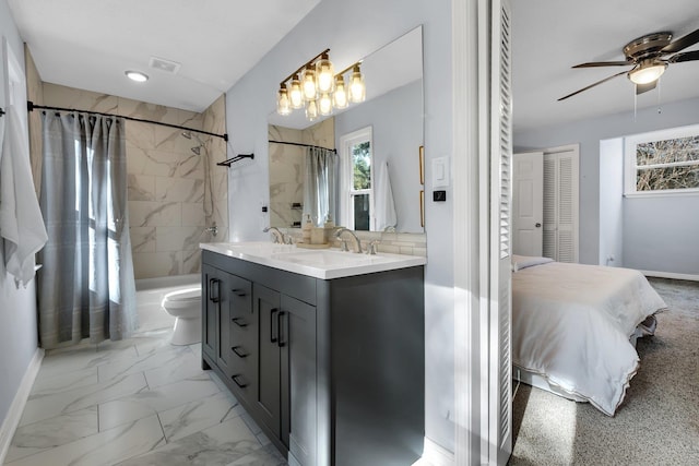 full bathroom with toilet, ceiling fan, shower / bath combo, and vanity