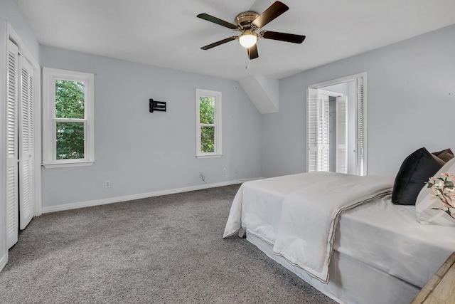 carpeted bedroom featuring ceiling fan and a closet