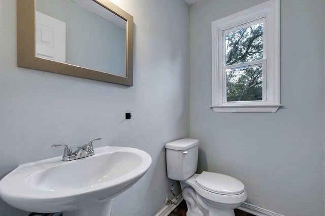 bathroom featuring toilet and sink