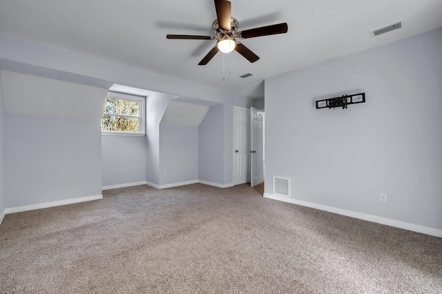 bonus room featuring ceiling fan and carpet floors