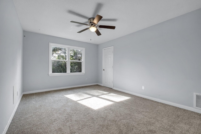 unfurnished room featuring carpet floors and ceiling fan