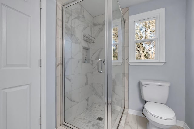 bathroom with toilet and an enclosed shower