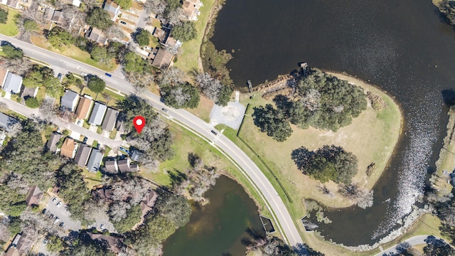 drone / aerial view featuring a water view and a residential view