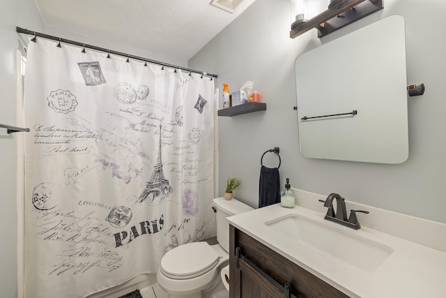 full bathroom featuring curtained shower, visible vents, vanity, and toilet