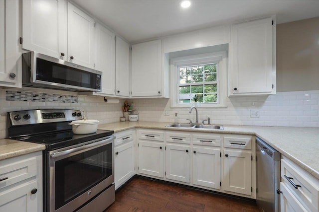 3256 N Shannon Lakes Dr, Tallahassee, FL 32309 - kitchen featuring stainless steel appliances, a sink, and white cabinets
