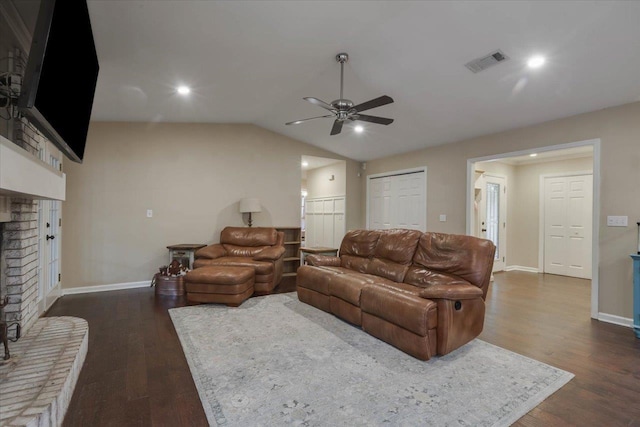 3256 N Shannon Lakes Dr, Tallahassee, FL 32309 - living area with a brick fireplace, ceiling fan, dark wood-style floors, lofted ceiling, and baseboards