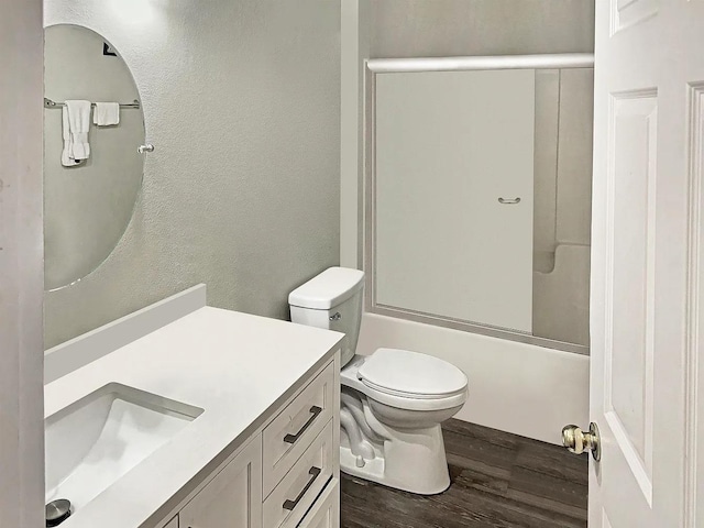 4434 Gearhart Rd Unit 1601, Tallahassee, FL 32303 - full bathroom featuring wood finished floors, vanity, toilet, a textured wall, and bathing tub / shower combination