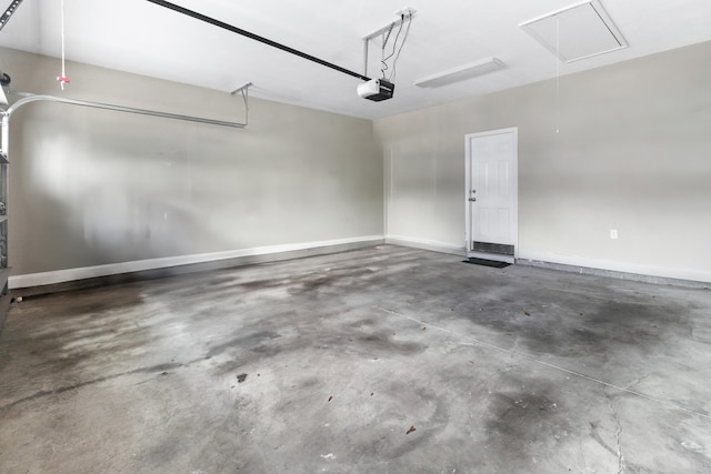 10732 Sycamore Ridge Ln, Tallahassee, FL 32305 - garage with a garage door opener and baseboards