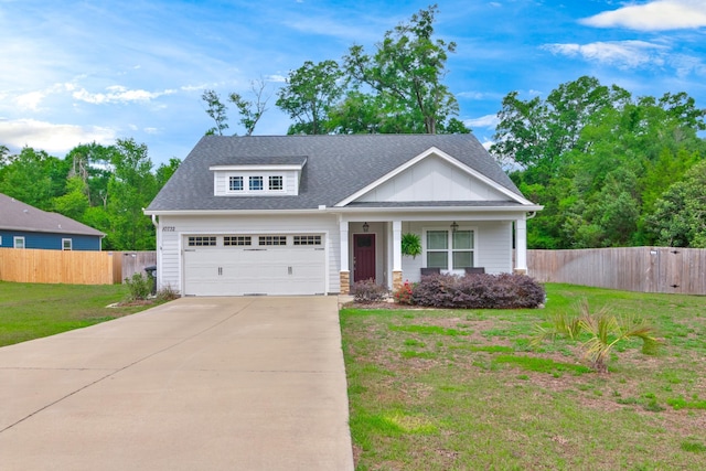 10732 Sycamore Ridge Ln, Tallahassee, FL 32305 - view of front of property with driveway, covered porch, roof with shingles, and a garage