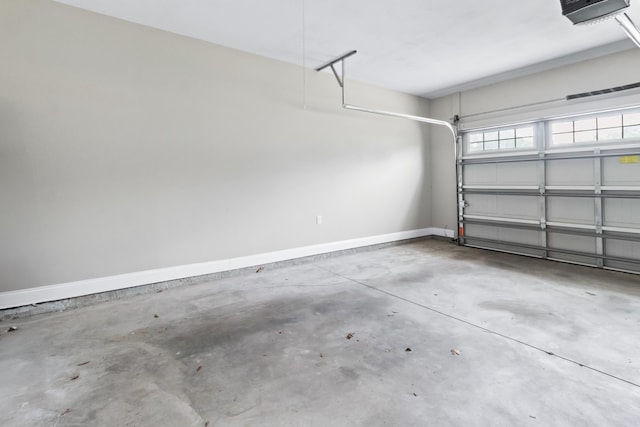 10732 Sycamore Ridge Ln, Tallahassee, FL 32305 - garage featuring baseboards and a garage door opener