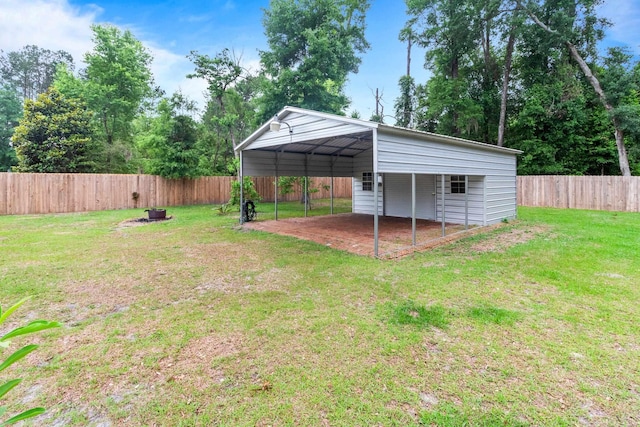 10732 Sycamore Ridge Ln, Tallahassee, FL 32305 - view of yard featuring a carport and an outdoor fire pit