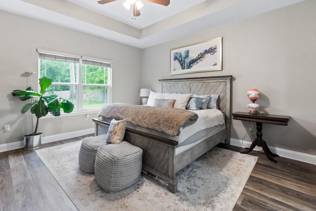 10732 Sycamore Ridge Ln, Tallahassee, FL 32305 - bedroom featuring wood finished floors, baseboards, ceiling fan, and a tray ceiling