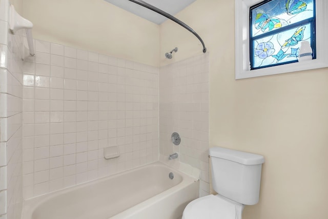 bathroom with toilet and shower / tub combination