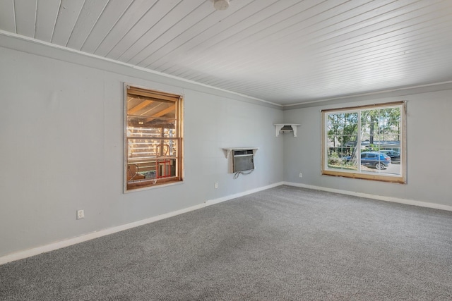 empty room featuring carpet flooring and baseboards