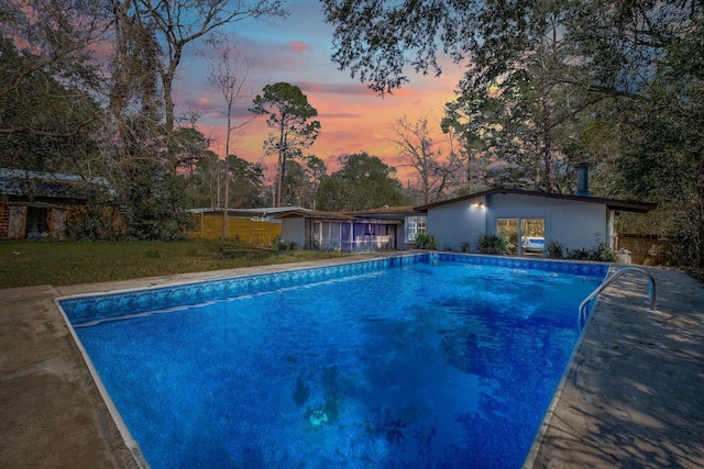 outdoor pool with a lawn