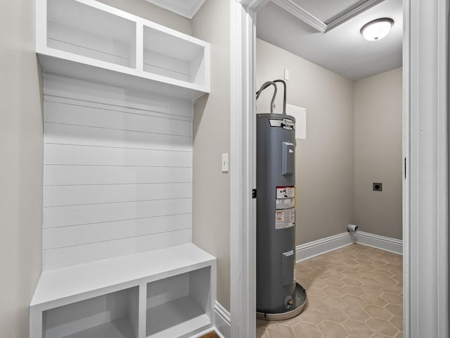 mudroom featuring electric water heater, light tile patterned floors, and crown molding