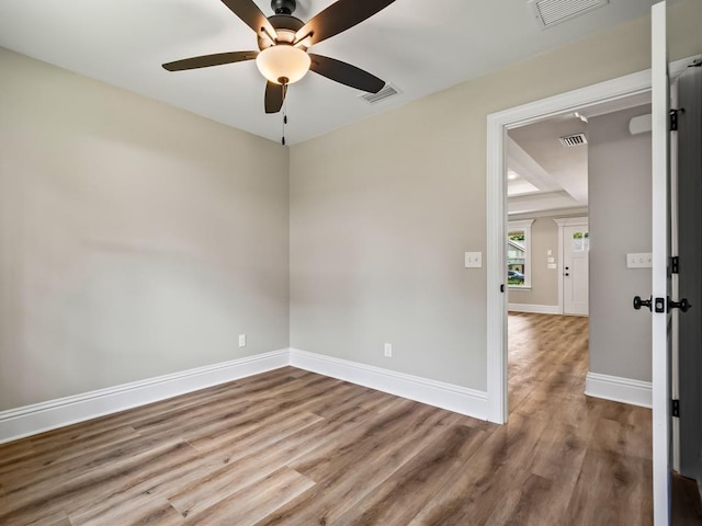 spare room featuring ceiling fan and hardwood / wood-style flooring