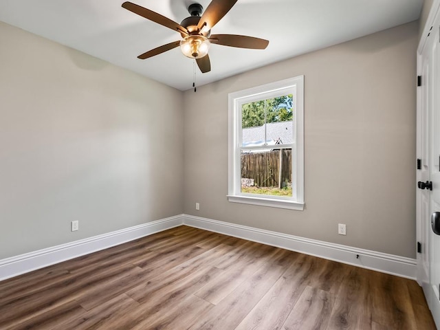 empty room featuring ceiling fan and wood-type flooring