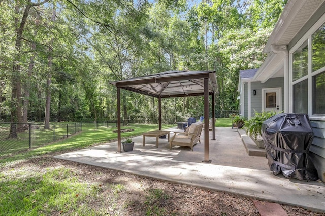 4557 Running Meadows Ln, Tallahassee, FL 32303 - fenced backyard featuring a gazebo, a patio, outdoor lounge area, and grilling area