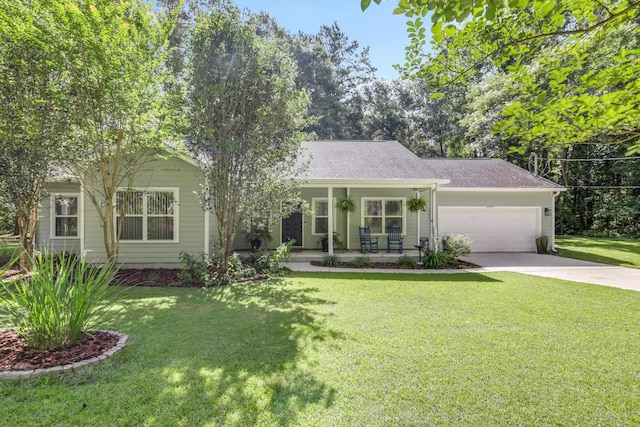 4557 Running Meadows Ln, Tallahassee, FL 32303 - view of front of property with a garage, covered porch, concrete driveway, a front lawn, and a shingled roof