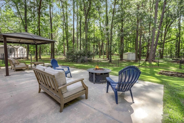 4557 Running Meadows Ln, Tallahassee, FL 32303 - view of patio / terrace with an outdoor fire pit, a storage unit, and a gazebo