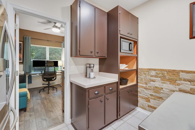 4557 Running Meadows Ln, Tallahassee, FL 32303 - kitchen with light countertops, an office area, a ceiling fan, light wood finished floors, and freestanding refrigerator