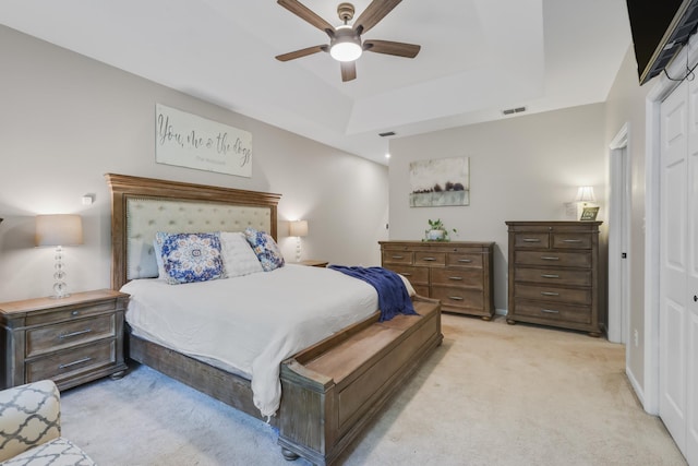 4557 Running Meadows Ln, Tallahassee, FL 32303 - bedroom with light colored carpet, a ceiling fan, and a tray ceiling