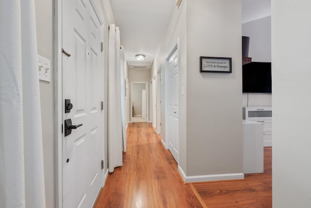4557 Running Meadows Ln, Tallahassee, FL 32303 - corridor featuring light wood-style flooring and baseboards