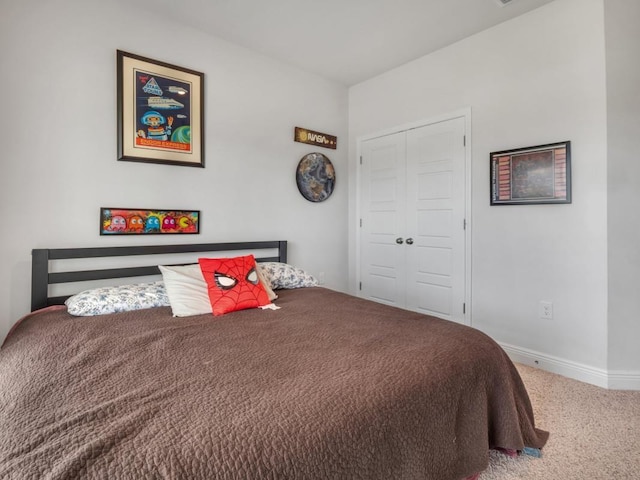 carpeted bedroom featuring a closet