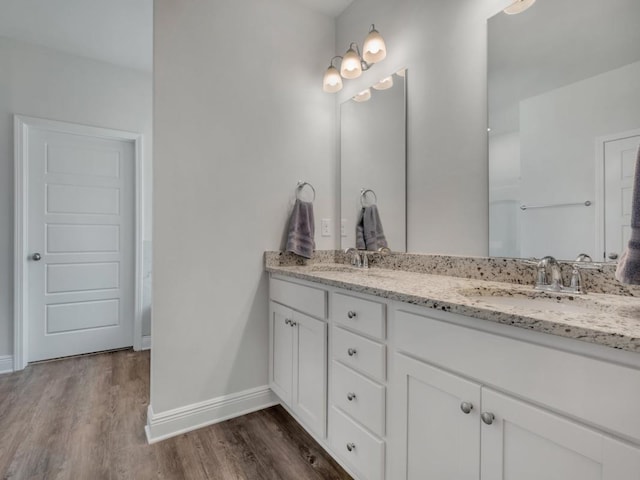 bathroom featuring vanity and hardwood / wood-style flooring