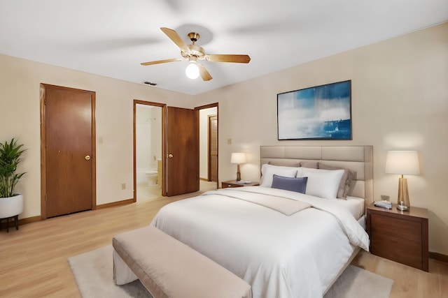 bedroom with ensuite bathroom, ceiling fan, and light wood-type flooring