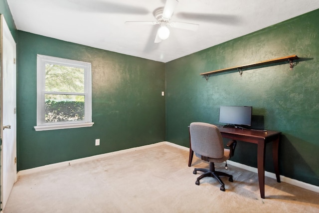 home office featuring a ceiling fan and baseboards