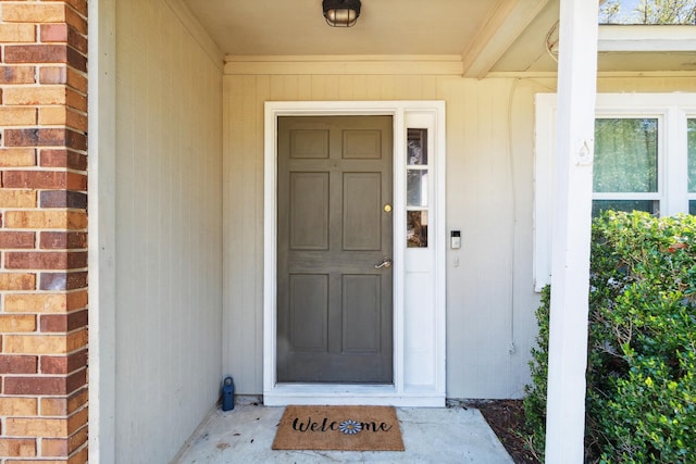 entrance to property with brick siding