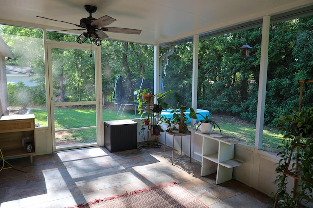 sunroom / solarium with ceiling fan